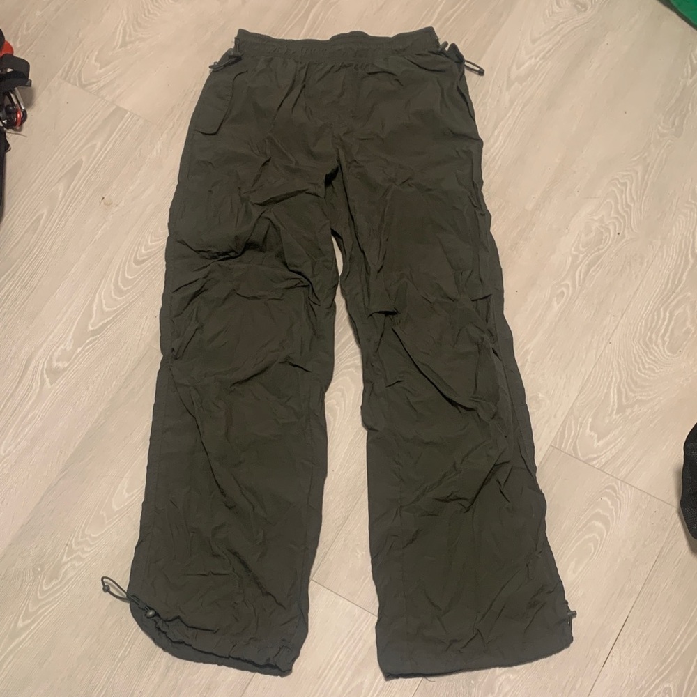 Woman’s olive green parachute pants